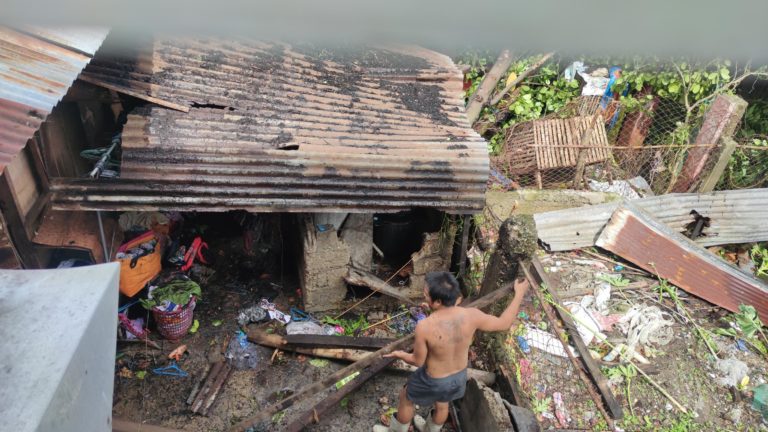 Families try to rebuild their fallen house using scrap materials in Cebu South.